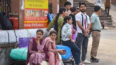 People from Doda and Kishtwar regions wait for buses outside a bus stand to return to their homes, in Jammu. They had come to Jammu seeking safety from Pakistani shelling.&nbsp; (PTI)