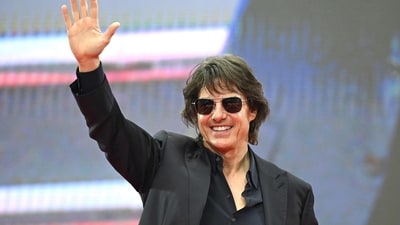 Tom Cruise's notable career reportedly may soon be recognised with a knighthood, expected next month.
(Photo by Jung Yeon-je / AFP) (AFP)