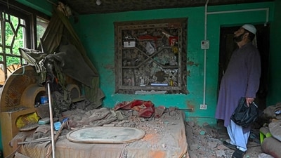 After a wave of Pakistani shelling, a resident in Uri examines his home which has been destroyed. (Tauseef Mustafa/AFP) After a wave of Pakistani shelling, a resident in Uri examines his home which has been destroyed. (Tauseef Mustafa/AFP)