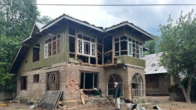 A man takes stock of the damage to his home in Uri. This comes as India and Pakistan have been at loggerheads against each other after terrorist camps were destroyed at nine locations in the neigbouring country under Operation Sindoor, which was launched in response to the ghastly Pahalgam terrorist attack.&nbsp; (Waseem Andrabi/HT)