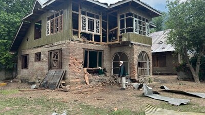 A man stands near damaged houses after shelling by Pakistani troops in Jammu and Kashmir's Uri. (Waseem Andrabi/HT) A man stands near damaged houses after shelling by Pakistani troops in Jammu and Kashmir's Uri. (Waseem Andrabi/HT)