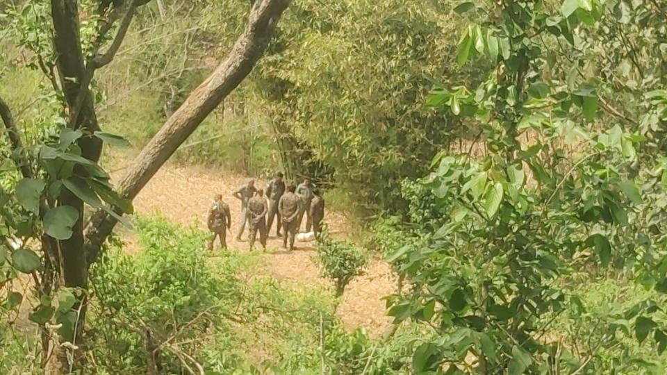 Defence personnel at the site where the missile landed in Hoshiarpur district. (HT Photo) Defence personnel at the site where the missile landed in Hoshiarpur district. (HT Photo)