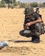 A security person inspecting the debris of a projectile in Rajasthan’s Jaisalmer. (PTI) A security person inspecting the debris of a projectile in Rajasthan’s Jaisalmer. (PTI)
