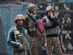 Indian army soldiers stand guard after loud explosions were heard in Srinagar.