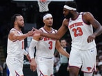 New York Knicks guard Jalen Brunson (11) and center Mitchell Robinson (23)