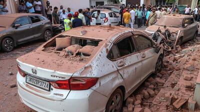 Damaged vehicles are pictured following Pakistani artillery shelling in Jammu, Jammu and Kashmir, India on Saturday. (AFP) Damaged vehicles are pictured following Pakistani artillery shelling in Jammu, Jammu and Kashmir, India on Saturday. (AFP)