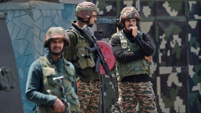 Indian army soldiers stand guard after loud explosions were heard in Srinagar. (AP) Indian army soldiers stand guard after loud explosions were heard in Srinagar. (AP)