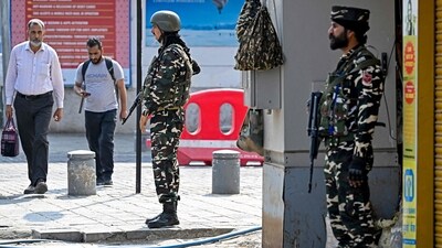 Indian paramilitary personnel stand guard along a roadside at the Lal Chowk in Srinagar on May 8. (AFP) Indian paramilitary personnel stand guard along a roadside at the Lal Chowk in Srinagar on May 8. (AFP)