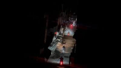 Vehicles move on a road during blackout. (PTI) Vehicles move on a road during blackout. (PTI)
