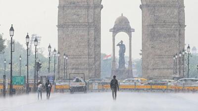 People caught in the rain at Kartavya Path in Delhi on Saturday. (Vipin Kumar/HT Photo) People caught in the rain at Kartavya Path in Delhi on Saturday. (Vipin Kumar/HT Photo)