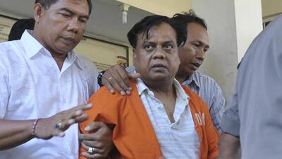 Police escort Indian gangster Rajendra Nikalje, widely known as Chhota Rajan, at police headquarters in Denpasar, Bali November 2, 2015 in this photo taken by Antara Foto. Indonesia will deport one of India's most wanted men on Tuesday to face charges in more than two dozen murder cases at home. Rajendra Nikalje was arrested by police on Indonesia's resort island of Bali last week, ending a two-decade-long international manhunt. Rajan has been on Interpol's wanted list since 1995 suspected of running a crime syndicate that engaged in extortion, arms struggling and contract killing. Picture taken November 2, 2015. REUTERS/Nyoman Budhiana/Antara Foto ATTENTION EDITORS - THIS IMAGE HAS BEEN SUPPLIED BY A THIRD PARTY. IT IS DISTRIBUTED, EXACTLY AS RECEIVED BY REUTERS, AS A SERVICE TO CLIENTS. FOR EDITORIAL USE ONLY. NOT FOR SALE FOR MARKETING OR ADVERTISING CAMPAIGNS. MANDATORY CREDIT. INDONESIA OUT. NO COMMERCIAL OR EDITORIAL SALES IN INDONESIA. TPX IMAGES OF THE DAY (REUTERS) Police escort Indian gangster Rajendra Nikalje, widely known as Chhota Rajan, at police headquarters in Denpasar, Bali November 2, 2015 in this photo taken by Antara Foto. Indonesia will deport one of India's most wanted men on Tuesday to face charges in more than two dozen murder cases at home. Rajendra Nikalje was arrested by police on Indonesia's resort island of Bali last week, ending a two-decade-long international manhunt. Rajan has been on Interpol's wanted list since 1995 suspected of running a crime syndicate that engaged in extortion, arms struggling and contract killing. Picture taken November 2, 2015. REUTERS/Nyoman Budhiana/Antara Foto ATTENTION EDITORS - THIS IMAGE HAS BEEN SUPPLIED BY A THIRD PARTY. IT IS DISTRIBUTED, EXACTLY AS RECEIVED BY REUTERS, AS A SERVICE TO CLIENTS. FOR EDITORIAL USE ONLY. NOT FOR SALE FOR MARKETING OR ADVERTISING CAMPAIGNS. MANDATORY CREDIT. INDONESIA OUT. NO COMMERCIAL OR EDITORIAL SALES IN INDONESIA. TPX IMAGES OF THE DAY (REUTERS)