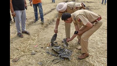 Security personnel inspect the debris of an unidentified projectile which landed amid the conflict between India and Pakistan, in Jalandhar, Punjab on Saturday. (PTI) Security personnel inspect the debris of an unidentified projectile which landed amid the conflict between India and Pakistan, in Jalandhar, Punjab on Saturday. (PTI)