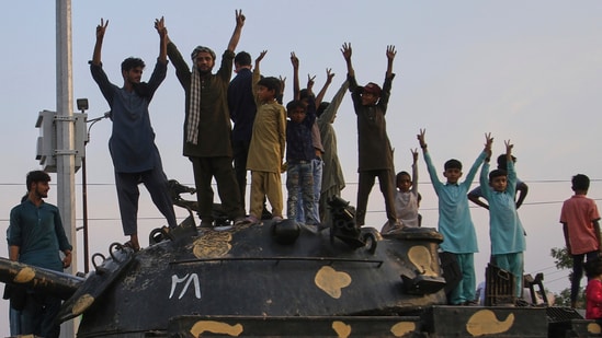 Pakistani nationals celebrate the ceasefire deal in Multan on Saturday. (AP)