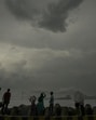 Representative picture (Mumbai: People at Dadar Chowpatty amid drizzle as dark clouds cover the skyline, in Mumbai, Wednesday, May 7, 2025. Mumbai received unseasonal showers accompanied by thunder and strong winds on the second consecutive day on Wednesday, providing a respite from heat while briefly affecting local train services and the flight schedule. (PTI Photo/Kunal Patil) (PTI05_07_2025_000493A) (PTI)