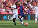 Barcelona edge past Real Madrid in seven-goal thriller to move closer to La Liga title.