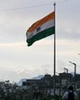 Snow-capped slopes of Trikuta hills pictured behind India's national flag in Jammu city on Sunday. (AFP) Snow-capped slopes of Trikuta hills pictured behind India's national flag in Jammu city on Sunday. (AFP)