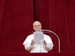 Pope Leo XIV leads a Regina Caeli prayer from the central balcony (Loggia delle Benedizioni) of St. Peter's Basilica, at the Vatican, May 11, 2025. 