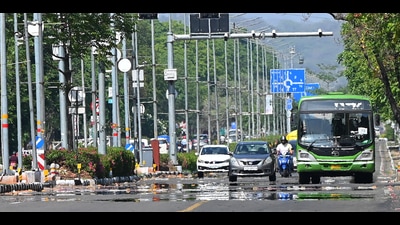A mirage appears on the Sector 16/17 dividing road amid searing heat in Chandigarh on Sunday. (Keshav Singh/HT) A mirage appears on the Sector 16/17 dividing road amid searing heat in Chandigarh on Sunday. (Keshav Singh/HT)