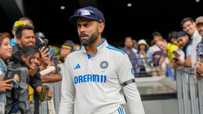 India's Virat Kohli walks out before the start of play during the Melbourne Test (AP) India's Virat Kohli walks out before the start of play during the Melbourne Test (AP)