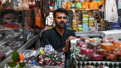 Hazoor Sheikh, a shop owner, waits for customers at his store in the market near the main bus stand in the border town of Poonch in India's Jammu region on May 11, 2025. (AFP) Hazoor Sheikh, a shop owner, waits for customers at his store in the market near the main bus stand in the border town of Poonch in India's Jammu region on May 11, 2025. (AFP)