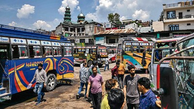 People gather at a bus stand in Poonch on May Sunday. (AFP) People gather at a bus stand in Poonch on May Sunday. (AFP)