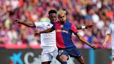 Barcelona edge past Real Madrid in seven-goal thriller to move closer to La Liga title. (REUTERS)