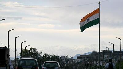 Snow-capped slopes of Trikuta hills pictured behind India's national flag in Jammu city on Sunday. (AFP) Snow-capped slopes of Trikuta hills pictured behind India's national flag in Jammu city on Sunday. (AFP)