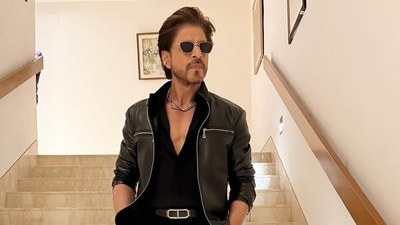 Shah Rukh Khan looks dapper in an all-black outfit and a diamond necklace for the IPL opening ceremony.