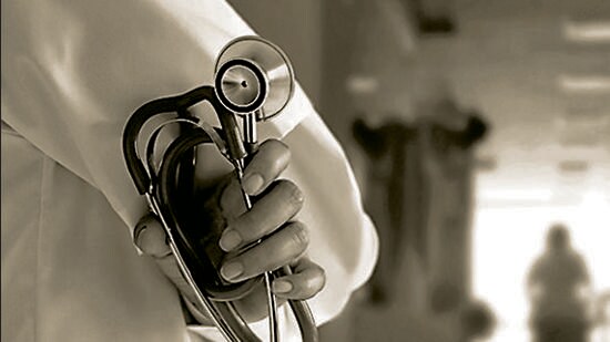 Doctor with stethoscope in hand on hospital background (Getty Images/iStockphoto)