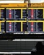A passenger checks flight status at T3 of IGI Airport. (Vipin Kumar/HT Photo)