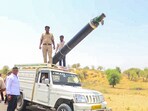 Police retrieve a large missile fragment after attacks by Pakistan, in Barmer on Saturday. Police retrieve a large missile fragment after attacks by Pakistan, in Barmer on Saturday.