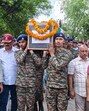 Army personnel carry the mortal remains of Subedar Major Pawan Kumar, who lost his life in cross-border shelling by the Pakistan Army, during his last rites in Kangra on Sunday. (ANI) Army personnel carry the mortal remains of Subedar Major Pawan Kumar, who lost his life in cross-border shelling by the Pakistan Army, during his last rites in Kangra on Sunday. (ANI)