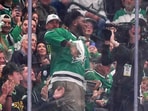 Tyler Booker, center, the Dallas Cowboys first-round NFL football draft pick, cheers the Dallas Stars in the second period of Game 3 of a second-round NHL hockey playoff series against the Winnipeg Jets in Dallas, Sunday, May 11, 2025. (AP Photo/Julio Cortez) Tyler Booker, center, the Dallas Cowboys first-round NFL football draft pick, cheers the Dallas Stars in the second period of Game 3 of a second-round NHL hockey playoff series against the Winnipeg Jets in Dallas, Sunday, May 11, 2025. (AP Photo/Julio Cortez)