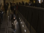 Commuters enter the London Underground at Waterloo railway station in London.