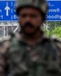 Paramilitary personnel stand guard along a street leading to the international airport in Srinagar on May 10 (AFP) Paramilitary personnel stand guard along a street leading to the international airport in Srinagar on May 10 (AFP)