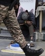 Soldiers patrol as a street vendor takes a nap after India and Pakistan reported no incidents of firing overnight in Srinagar on Monday (AP) Soldiers patrol as a street vendor takes a nap after India and Pakistan reported no incidents of firing overnight in Srinagar on Monday (AP)
