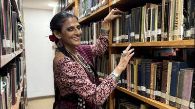 An elegantly attired library member with a red rose in her long black braid turns out to be artist and scholar Navina Jafa. (HT) An elegantly attired library member with a red rose in her long black braid turns out to be artist and scholar Navina Jafa. (HT)