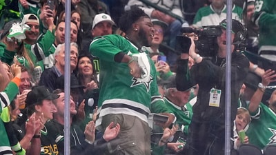 Tyler Booker, center, the Dallas Cowboys first-round NFL football draft pick, cheers the Dallas Stars in the second period of Game 3 of a second-round NHL hockey playoff series against the Winnipeg Jets in Dallas, Sunday, May 11, 2025. (AP Photo/Julio Cortez) (AP)