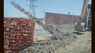 MC demolished illegal portions of buildings in Kanganwal, Jaspal Bangar, and nearby areas on Monday. (HT Photo)