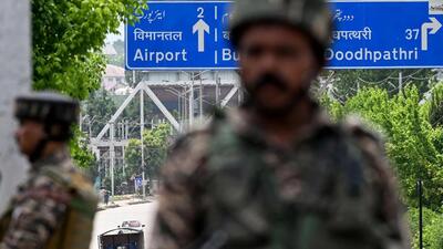 Paramilitary personnel stand guard along a street leading to the international airport in Srinagar on May 10 (AFP) Paramilitary personnel stand guard along a street leading to the international airport in Srinagar on May 10 (AFP)