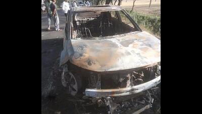 The charred remains of the car which caught fire claiming the life of a man in Bhiwani on Monday. (HT Photo)