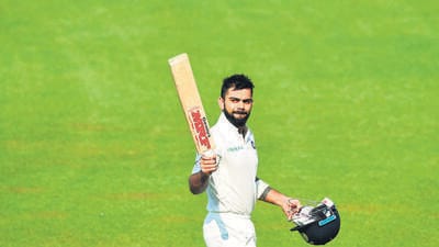 Virat Kohli gestures as he walks back after scoring his century and declaring the innings during the final day of the first Test between India and Sri Lanka at the Eden Gardens in November 2017. (AFP)