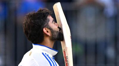 Virat Kohli kisses his bat after reaching a century. (AFP File Photo) Virat Kohli kisses his bat after reaching a century. (AFP File Photo)
