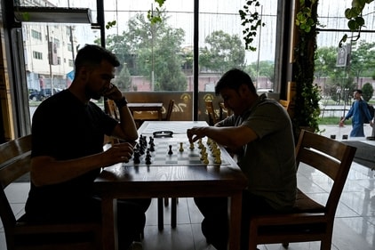 Men play chess at the Cupcake Coffee Shop cafe in Kabul On May 11, 2025. Taliban authorities have barred chess across Afghanistan until further notice over concerns it is a source of gambling, which is illegal under the government's morality law, a sports official said on May 11. (Photo by Wakil KOHSAR / AFP) (AFP) Men play chess at the Cupcake Coffee Shop cafe in Kabul On May 11, 2025. Taliban authorities have barred chess across Afghanistan until further notice over concerns it is a source of gambling, which is illegal under the government's morality law, a sports official said on May 11. (Photo by Wakil KOHSAR / AFP) (AFP)
