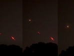 In this combo photo, red streaks are seen as India's air defence intercepts suspected drones, near the International Border, in Samba district, J&K, Monday. In this combo photo, red streaks are seen as India's air defence intercepts suspected drones, near the International Border, in Samba district, J&K, Monday.