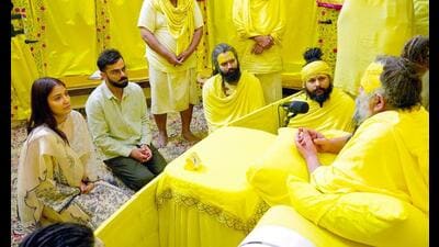 Cricketer Virat Kohli along with his wife and Bollywood actress Anushka Sharma, listens to spiritual guru Premanand Maharaj during their visit to Shri Radha Keli Kunj ashram, in Vrindavan on Tuesday. (ANI Photo) Cricketer Virat Kohli along with his wife and Bollywood actress Anushka Sharma, listens to spiritual guru Premanand Maharaj during their visit to Shri Radha Keli Kunj ashram, in Vrindavan on Tuesday. (ANI Photo)