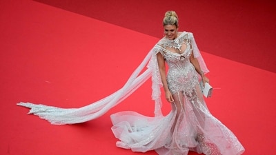 Israeli tv presenter, actress Hofit Golan arrives for the Opening Ceremony and the screening of the film "Partir un Jour" (Bye Bye) presented out of competition at the 78th edition of the Cannes Film Festival in Cannes, southern France, on May 13, 2025. (Photo by Miguel MEDINA / AFP) (AFP) Israeli tv presenter, actress Hofit Golan arrives for the Opening Ceremony and the screening of the film "Partir un Jour" (Bye Bye) presented out of competition at the 78th edition of the Cannes Film Festival in Cannes, southern France, on May 13, 2025. (Photo by Miguel MEDINA / AFP) (AFP)