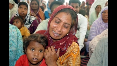 Grieving family members of one of the victims, Karnail Singh, at Threawal village in Amritsar on Tuesday. (Sameer Sehgal/HT) Grieving family members of one of the victims, Karnail Singh, at Threawal village in Amritsar on Tuesday. (Sameer Sehgal/HT)