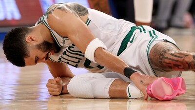 Jayson Tatum #0 of the Boston Celtics holds his ankle on the ground after being injured against the New York Knicks during the fourth quarter in Game Four of the Eastern Conference Second Round NBA Playoffs at Madison Square Garden on May 12, 2025 in New York City. (Getty Images via AFP) Jayson Tatum #0 of the Boston Celtics holds his ankle on the ground after being injured against the New York Knicks during the fourth quarter in Game Four of the Eastern Conference Second Round NBA Playoffs at Madison Square Garden on May 12, 2025 in New York City. (Getty Images via AFP)