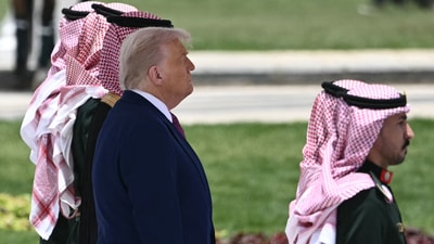 US President Donald Trump review the honour guard at the Royal Court in Riyadh on May 13, 2025. (Photo by Brendan SMIALOWSKI / AFP) (AFP) US President Donald Trump review the honour guard at the Royal Court in Riyadh on May 13, 2025. (Photo by Brendan SMIALOWSKI / AFP) (AFP)